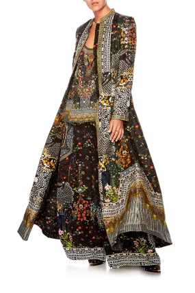 LONG PANELLED COAT BEHIND CLOSED DOORS