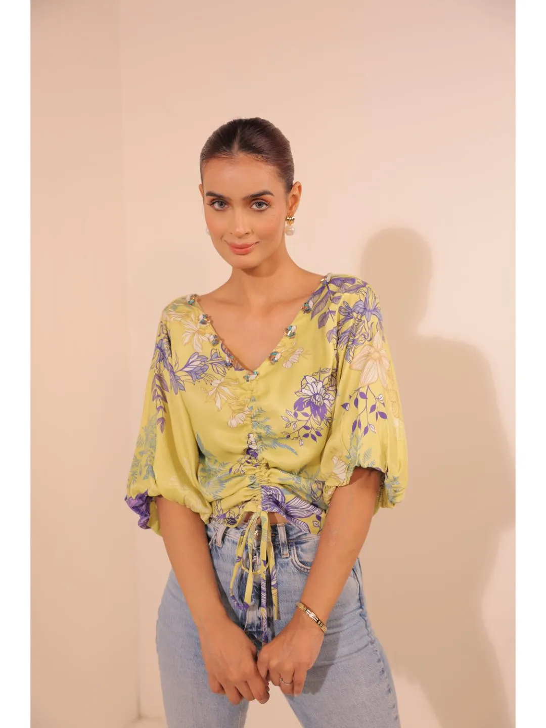 modish viscose royal satin floral printed V-Neck centre front draw string tie-up top with bishop sleeve . - Yellow