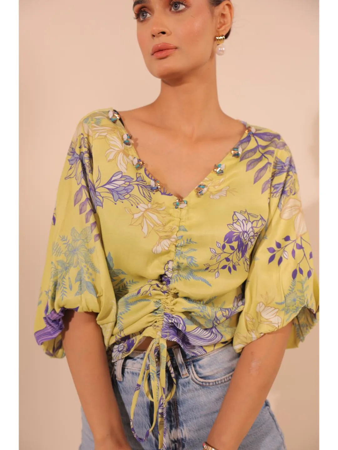 modish viscose royal satin floral printed V-Neck centre front draw string tie-up top with bishop sleeve . - Yellow