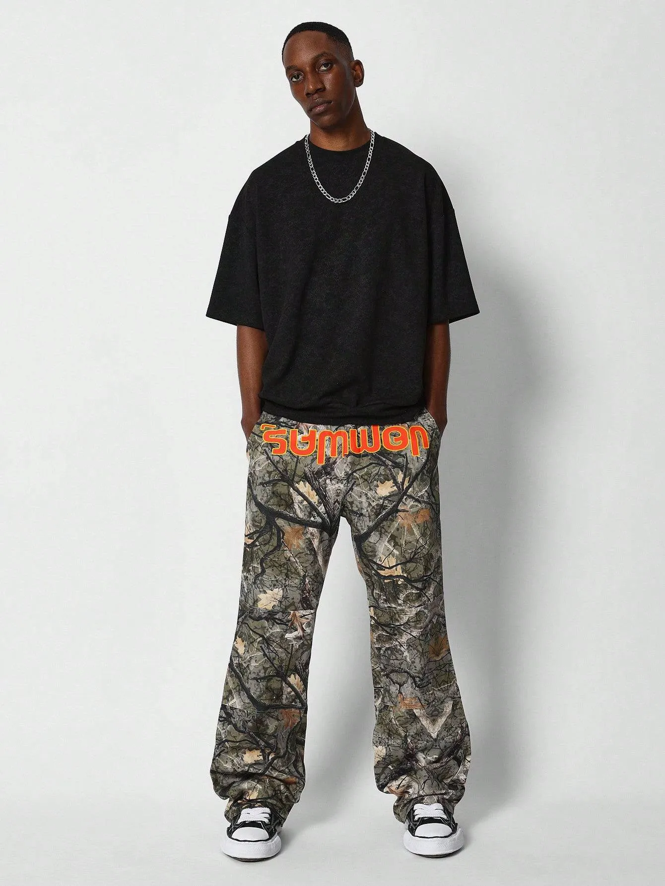 SUMWON Loose Fit All Over Camo Pant With Front Print